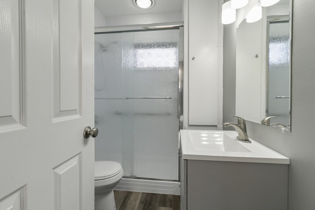 69 Redlands Street Springfield, MA 01104 - Photo 17 of 29 a bathroom with a sink a toilet and shower