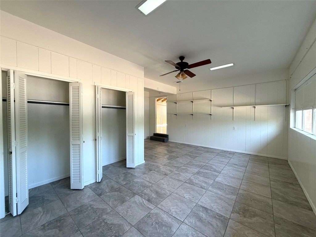 2711 Little John Lane Austin, TX 78704 - Photo 20 of 30 a view of a livingroom with a ceiling fan and window