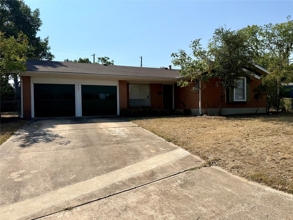 2711 Little John Lane Austin, TX 78704 - Photo 2 of 30 a view of a house with a yard