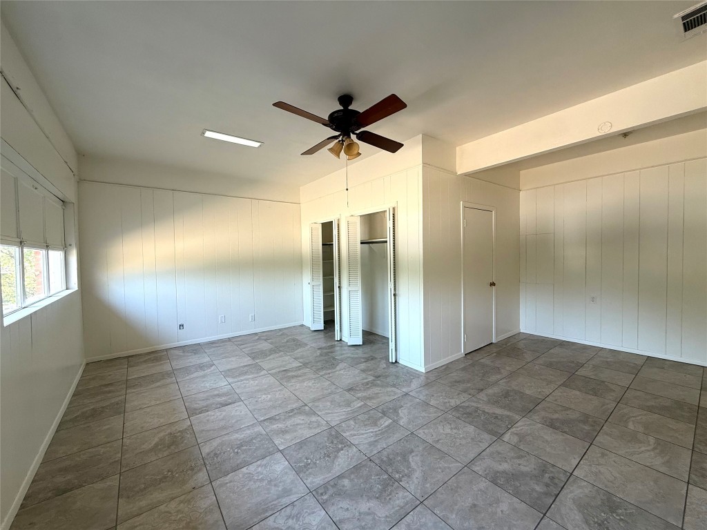 2711 Little John Lane Austin, TX 78704 - Photo 21 of 30 a view of a livingroom with a chandelier fan and windows