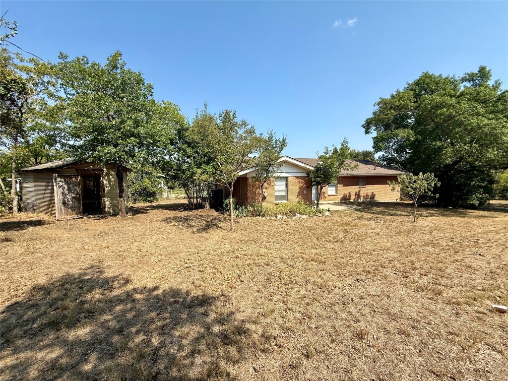 2711 Little John Lane Austin, TX 78704 - Photo 26 of 30 a front view of a house with a yard