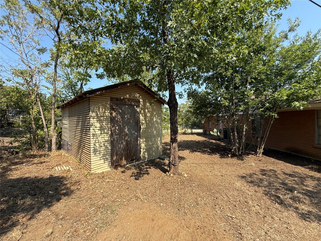 2711 Little John Lane Austin, TX 78704 - Photo 28 of 30 a view of a house with a yard
