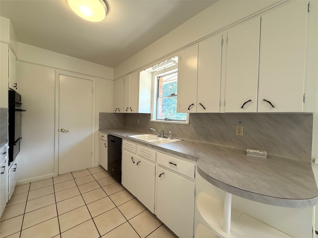 2711 Little John Lane Austin, TX 78704 - Photo 6 of 30 a kitchen with stainless steel appliances granite countertop a sink and a granite counter tops