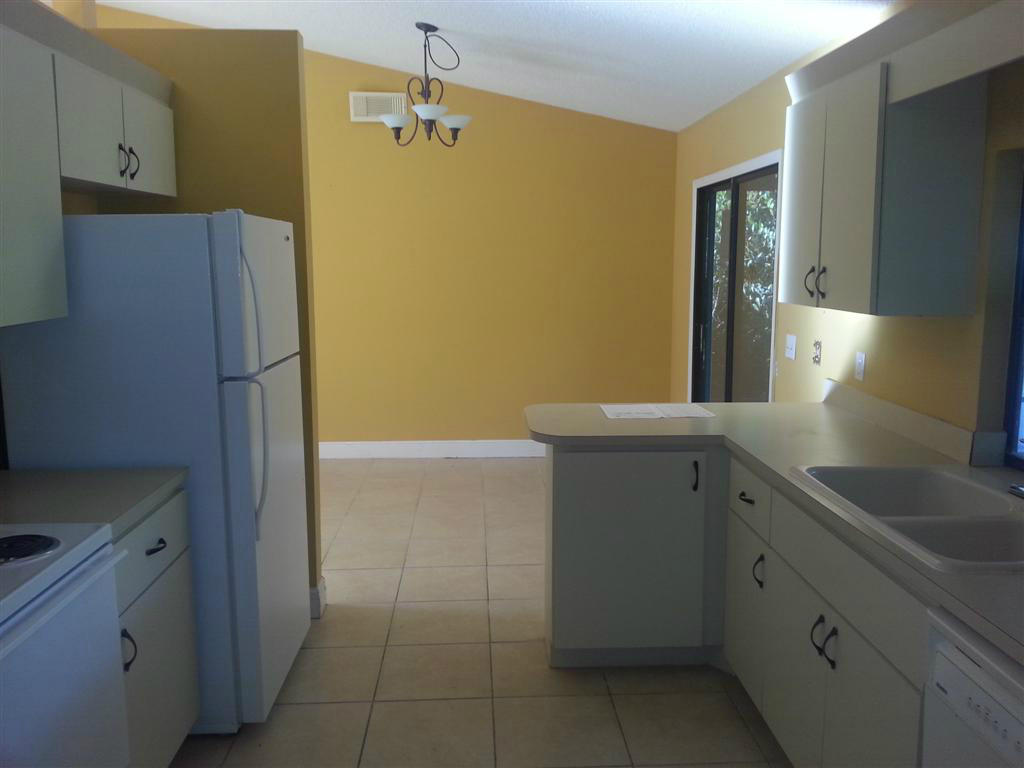 5511 Raintree Trail Fort Pierce, FL 34982 - Photo 6 of 15 Kitchen View into Dining Area