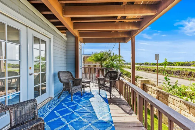 a view of a balcony with chairs