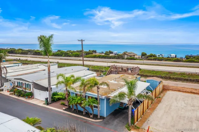 a view of swimming pool with outdoor seating and plants