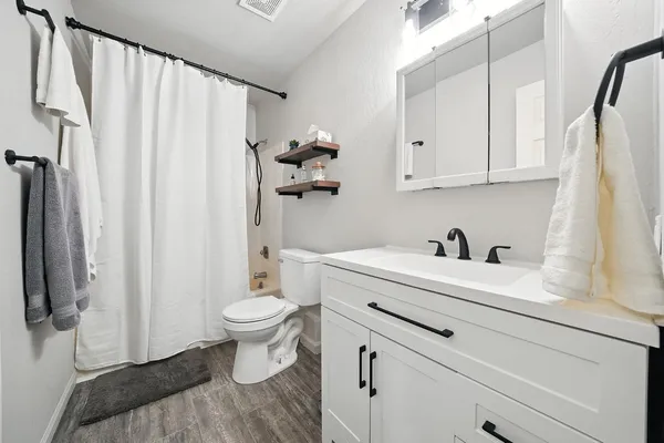 a view of bathroom with a sink and a toilet