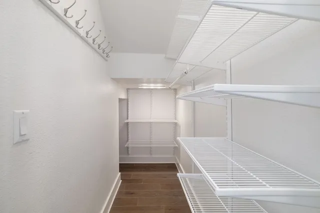 a view of a room with racks on the wall