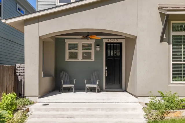 a bedroom with a bed and a potted plant