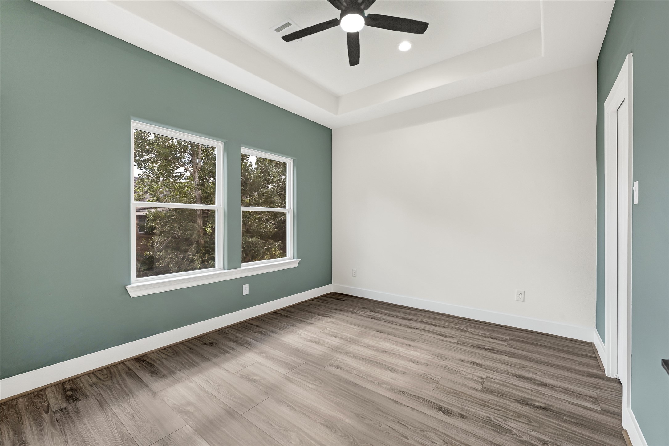 3834 Mt Pleasant Street Houston, TX 77021 - Photo 48 of 50 an empty room with wooden floor and windows