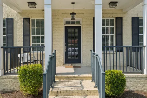 a white bath tub sitting next to a window