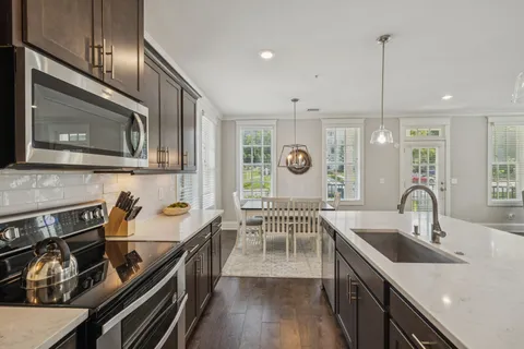 a bedroom with a bed window and a flat screen tv