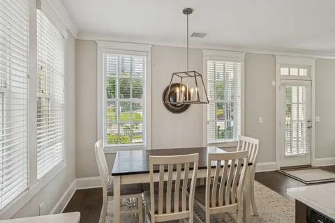 a bedroom with a bed and a table