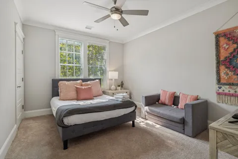 a kitchen with stainless steel appliances granite countertop a stove top oven a refrigerator a sink and chairs