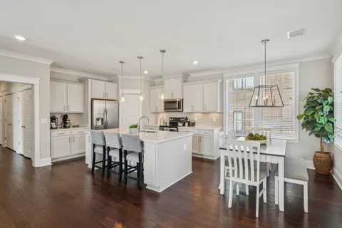 a front view of a building with a yard