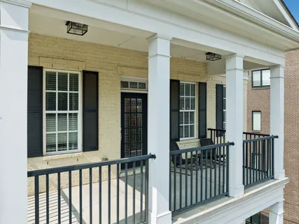 a front view of a house with a glass windows