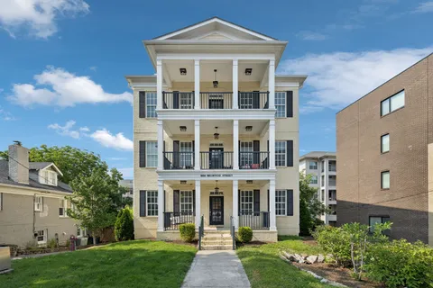 a kitchen with a refrigerator and a sink