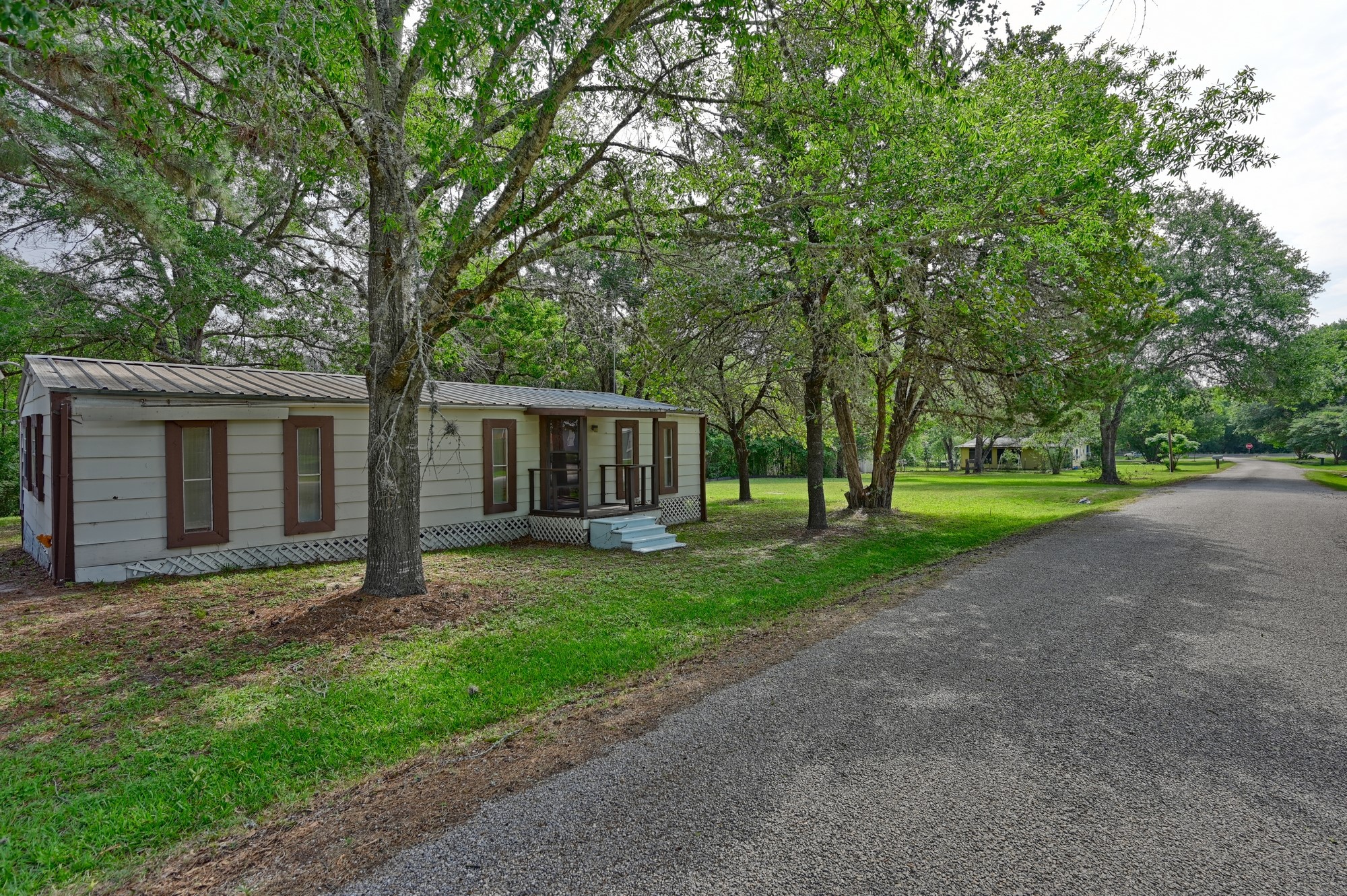 11200 Leisure Road Brenham, TX 77833 - Photo 1 of 23 a view of a house with a yard