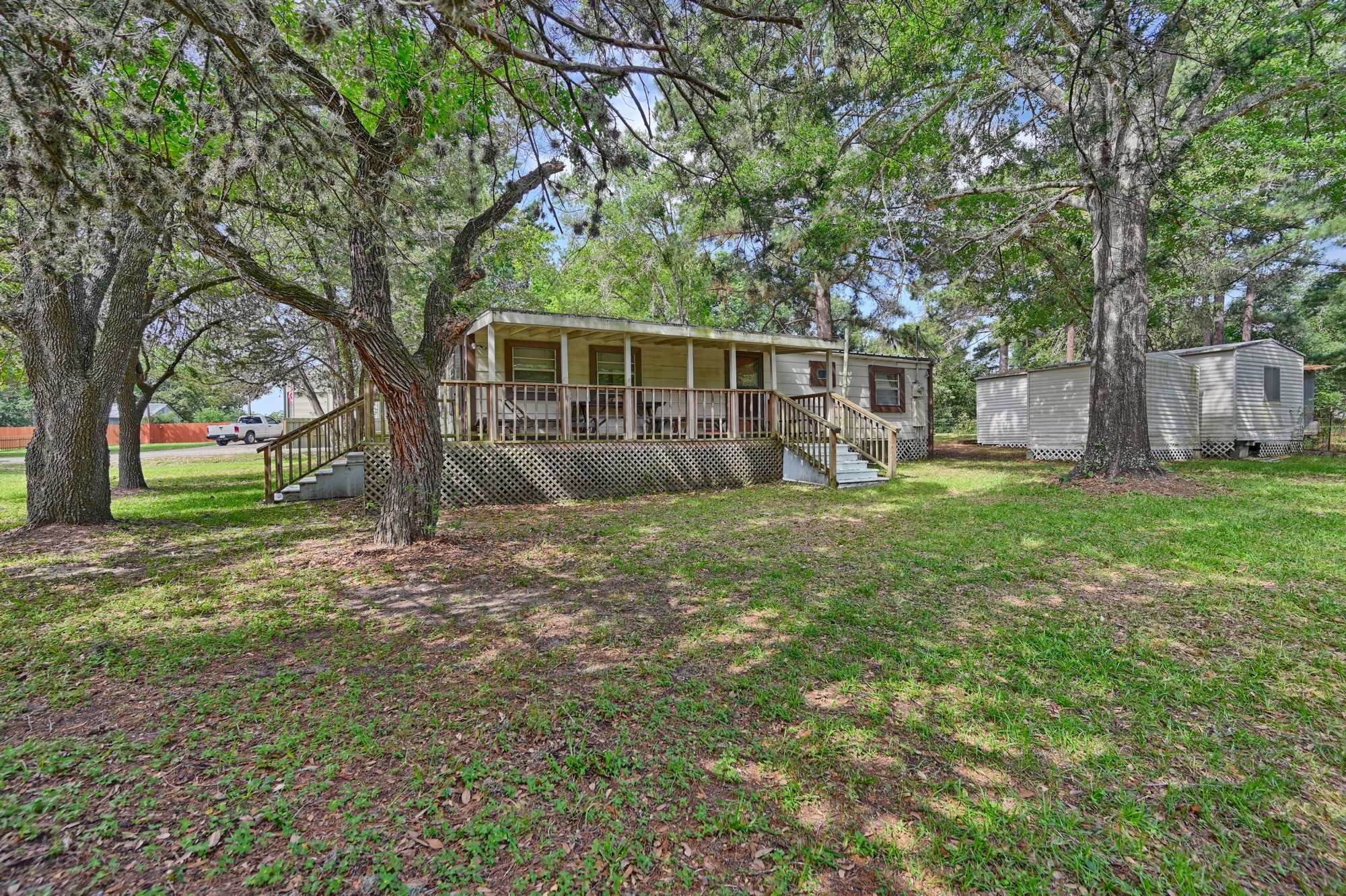 11200 Leisure Road Brenham, TX 77833 - Photo 13 of 23 a view of a backyard with a small cabin