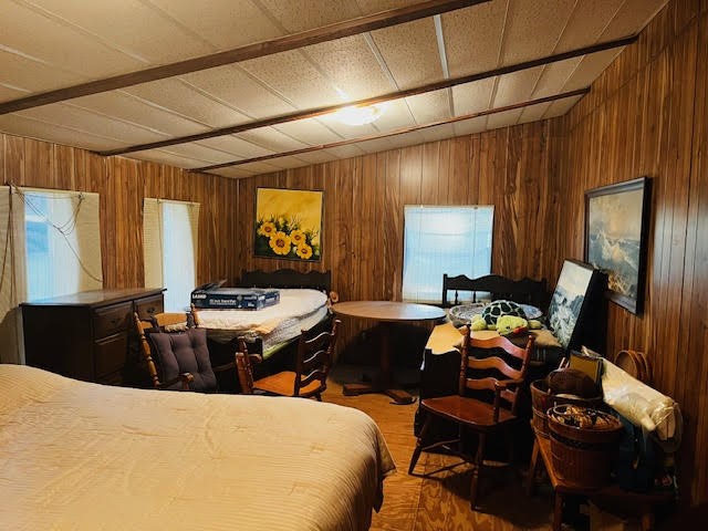 11200 Leisure Road Brenham, TX 77833 - Photo 21 of 23 a bedroom with a bed and wooden floor