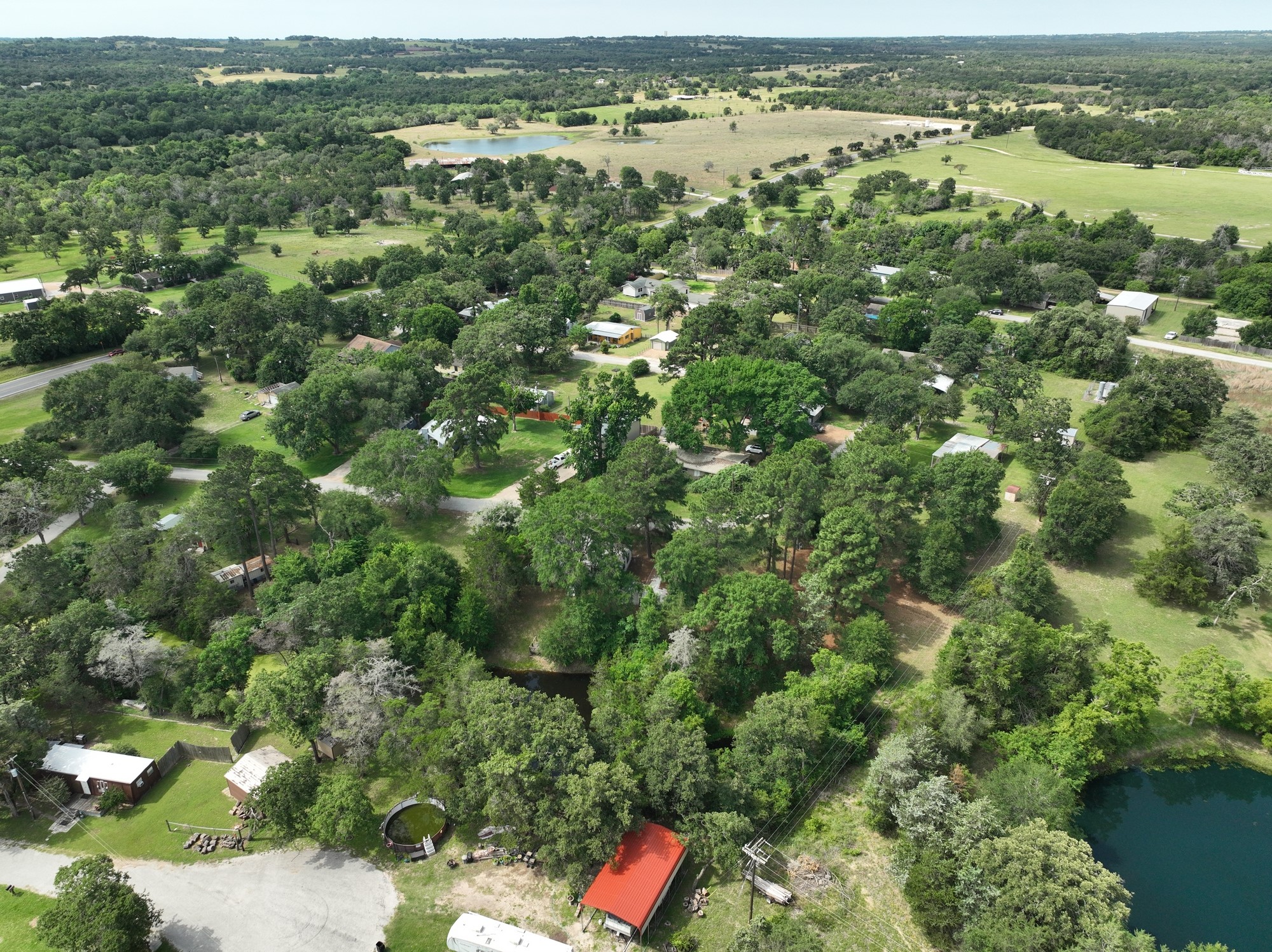 11200 Leisure Road Brenham, TX 77833 - Photo 22 of 23 an aerial view of residential houses with outdoor space and trees