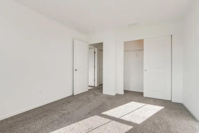 a view of an empty room with windows