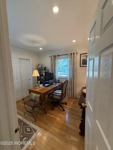 a living room with furniture a window and a table