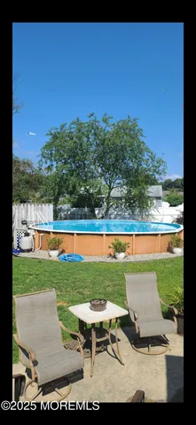 a view of a swimming pool and lounge chair