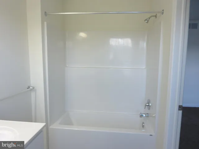 a bathroom with a toilet and a sink