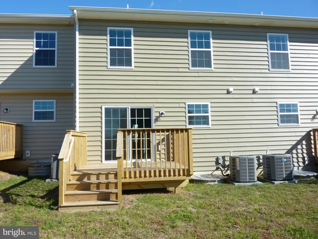 a view of a garden with a building in the background