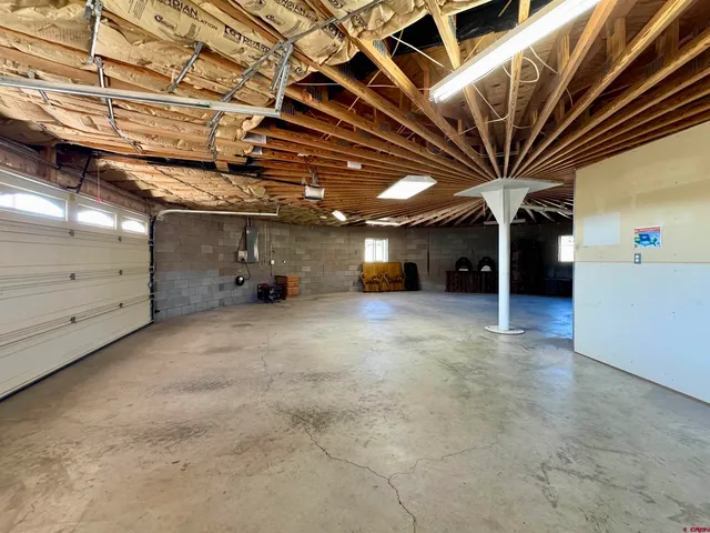 a view of a garage with wooden floors