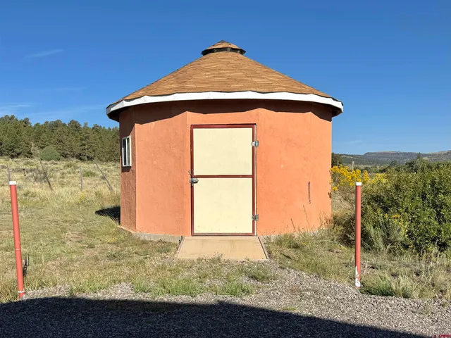 a blue sign that is next to a road