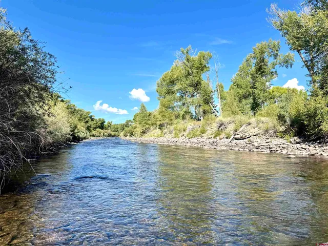 a view of a lake with a big yard