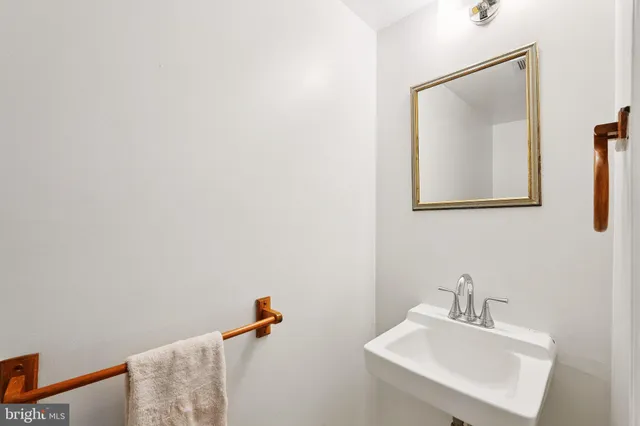 a bathroom with a sink and mirror