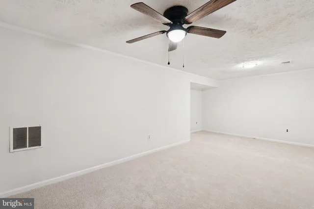 a view of a room with a fan