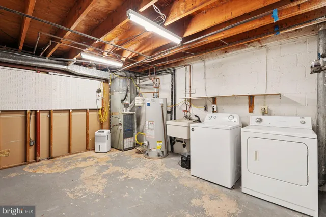 a view of backyard with wooden fence and trees