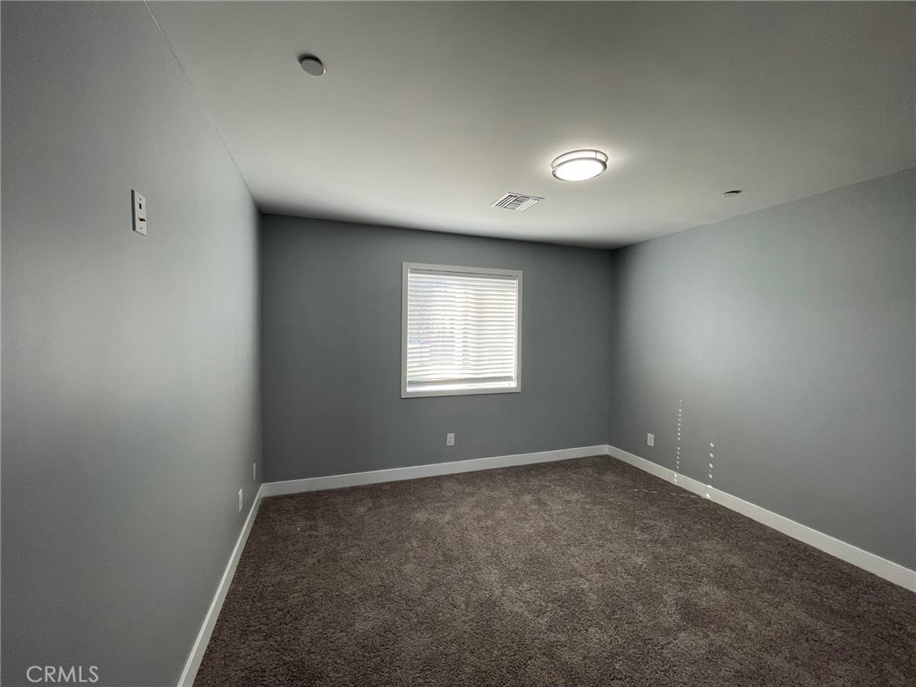 10055 East Ave R 10 Littlerock, CA 93543 - Photo 19 of 31 an empty room with a window