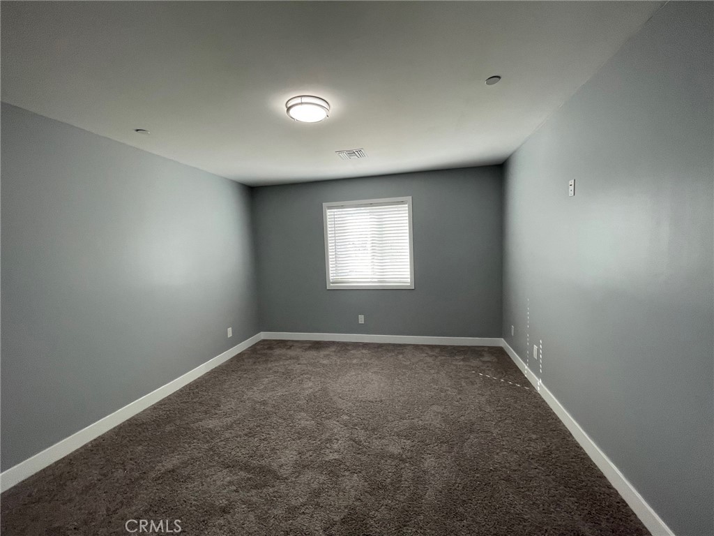 10055 East Ave R 10 Littlerock, CA 93543 - Photo 21 of 31 an empty room with a window
