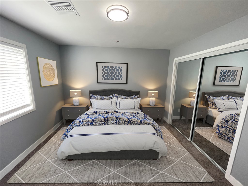 10055 East Ave R 10 Littlerock, CA 93543 - Photo 22 of 31 a bedroom with a bed and wooden floor