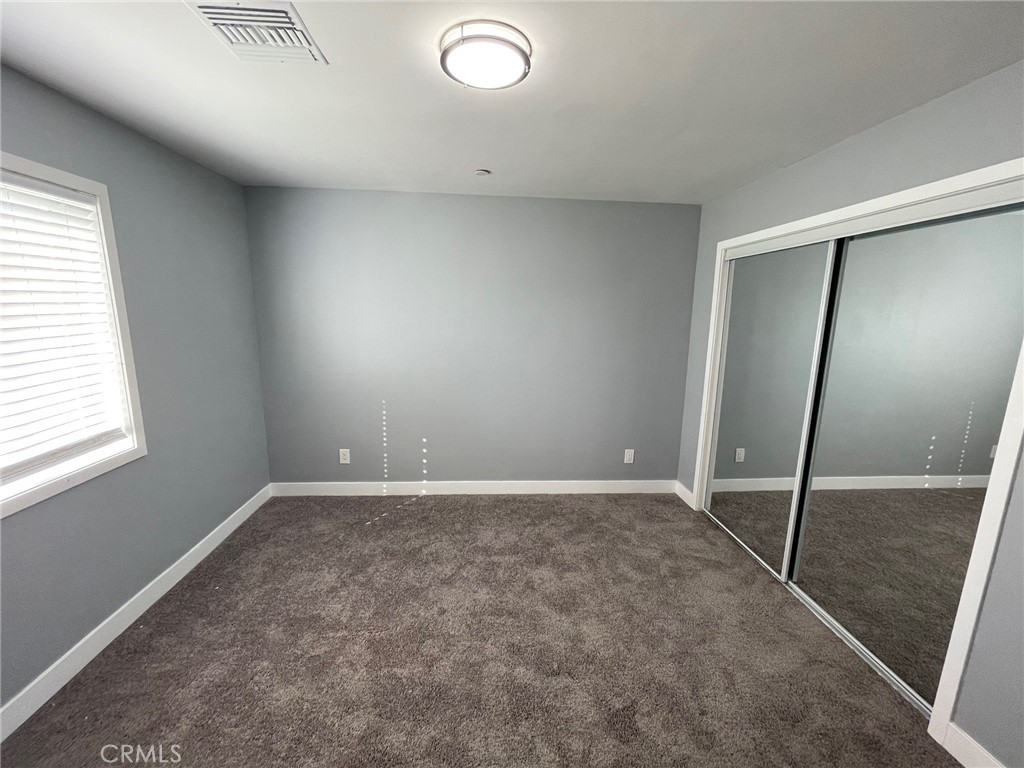 10055 East Ave R 10 Littlerock, CA 93543 - Photo 23 of 31 an empty room with a mirror