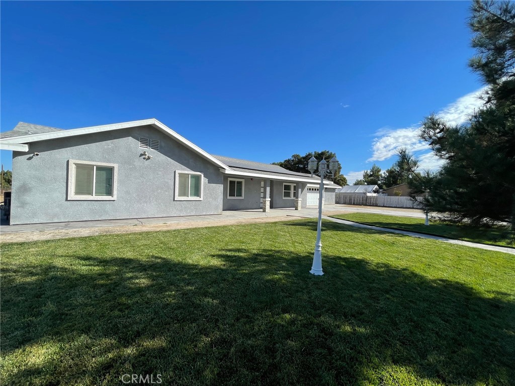 10055 East Ave R 10 Littlerock, CA 93543 - Photo 29 of 31 a house with a big yard
