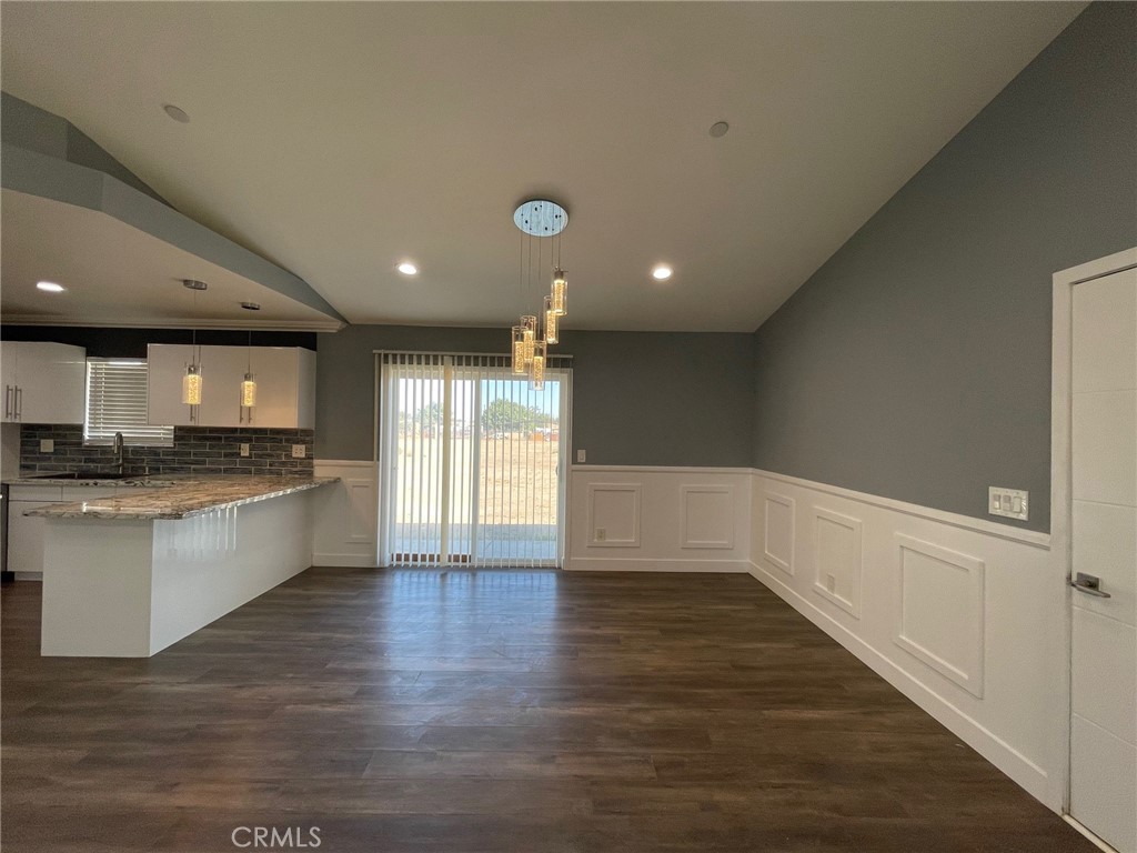 10055 East Ave R 10 Littlerock, CA 93543 - Photo 3 of 31 a view of kitchen with center island and stainless steel appliances