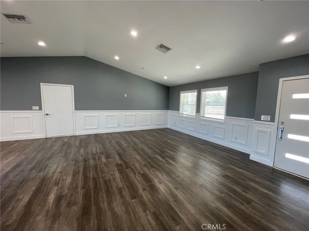 10055 East Ave R 10 Littlerock, CA 93543 - Photo 4 of 31 a view of empty room with wooden floor and fan