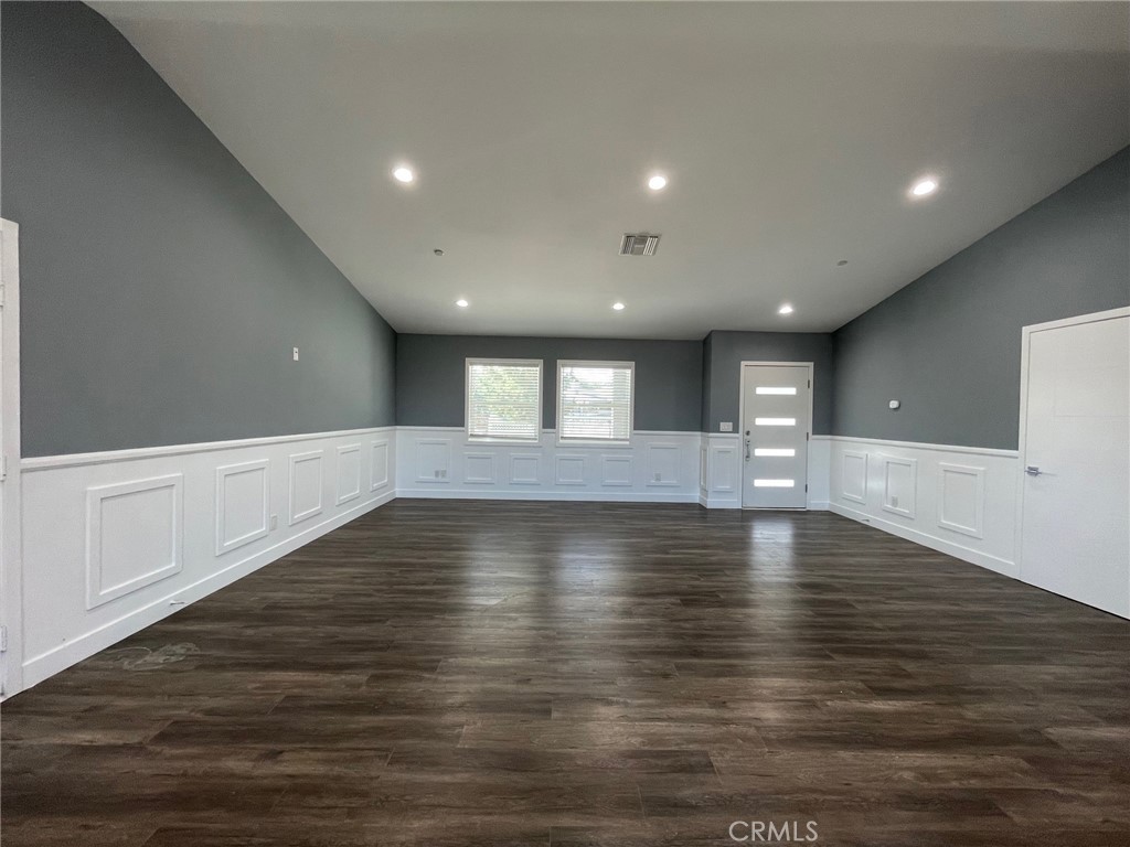 10055 East Ave R 10 Littlerock, CA 93543 - Photo 6 of 31 a view of empty room with wooden floor and window