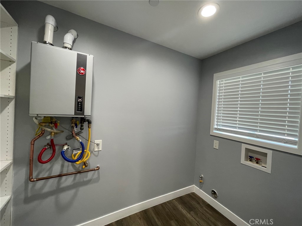 10055 East Ave R 10 Littlerock, CA 93543 - Photo 9 of 31 a bathroom with a window and cabinets