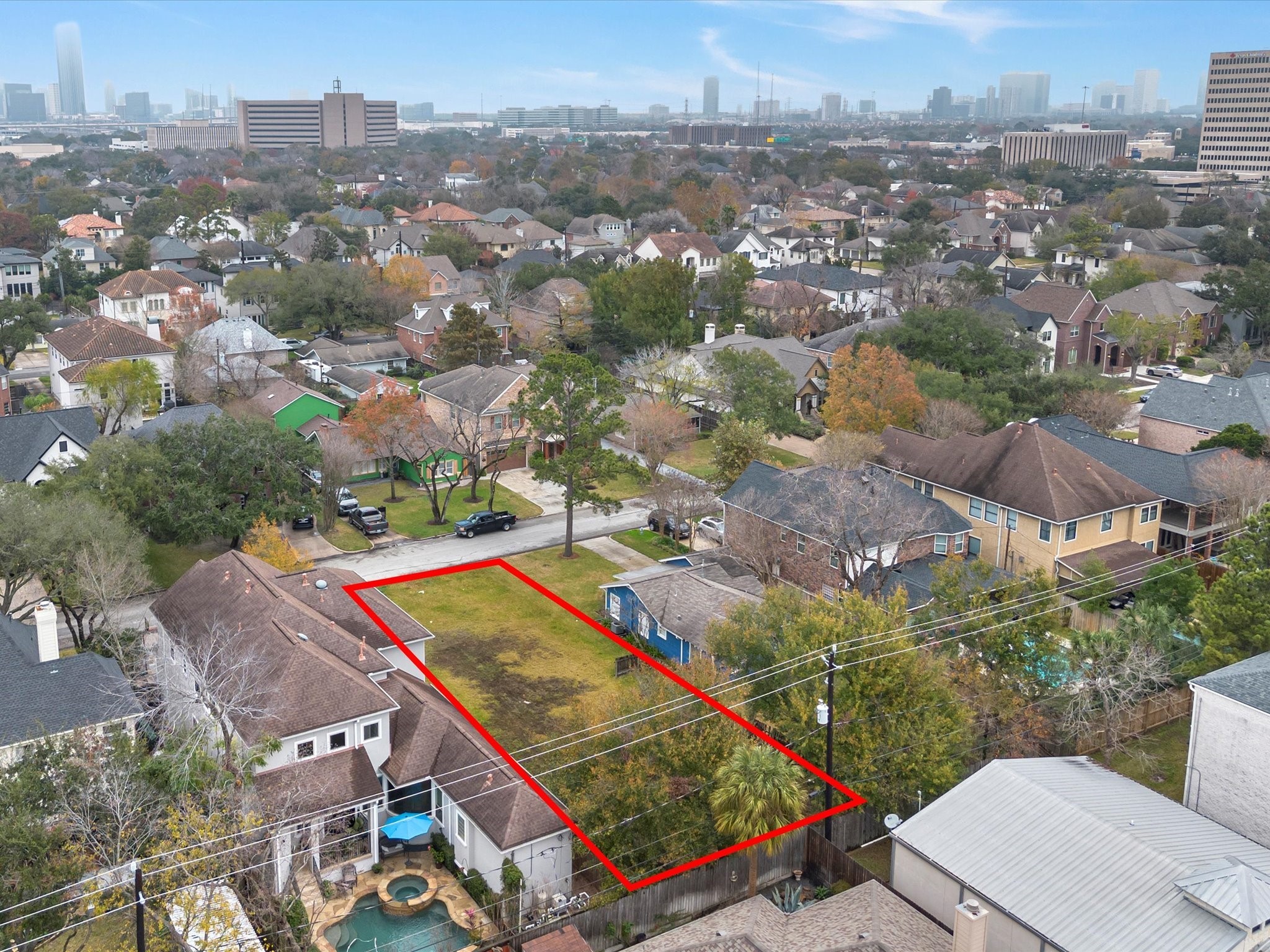 4921 Chestnut Street Bellaire, TX 77401 - Photo 2 of 9 an aerial view of residential houses with outdoor space and city view