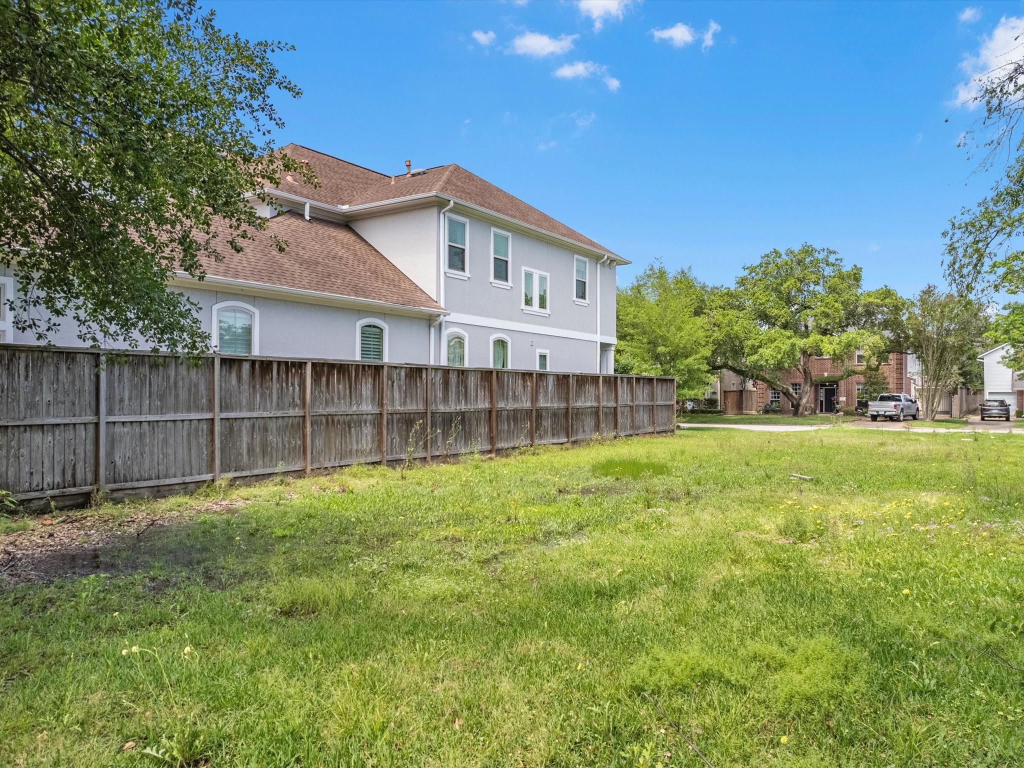 4921 Chestnut Street Bellaire, TX 77401 - Photo 8 of 9 a view of a house with a yard and sitting area