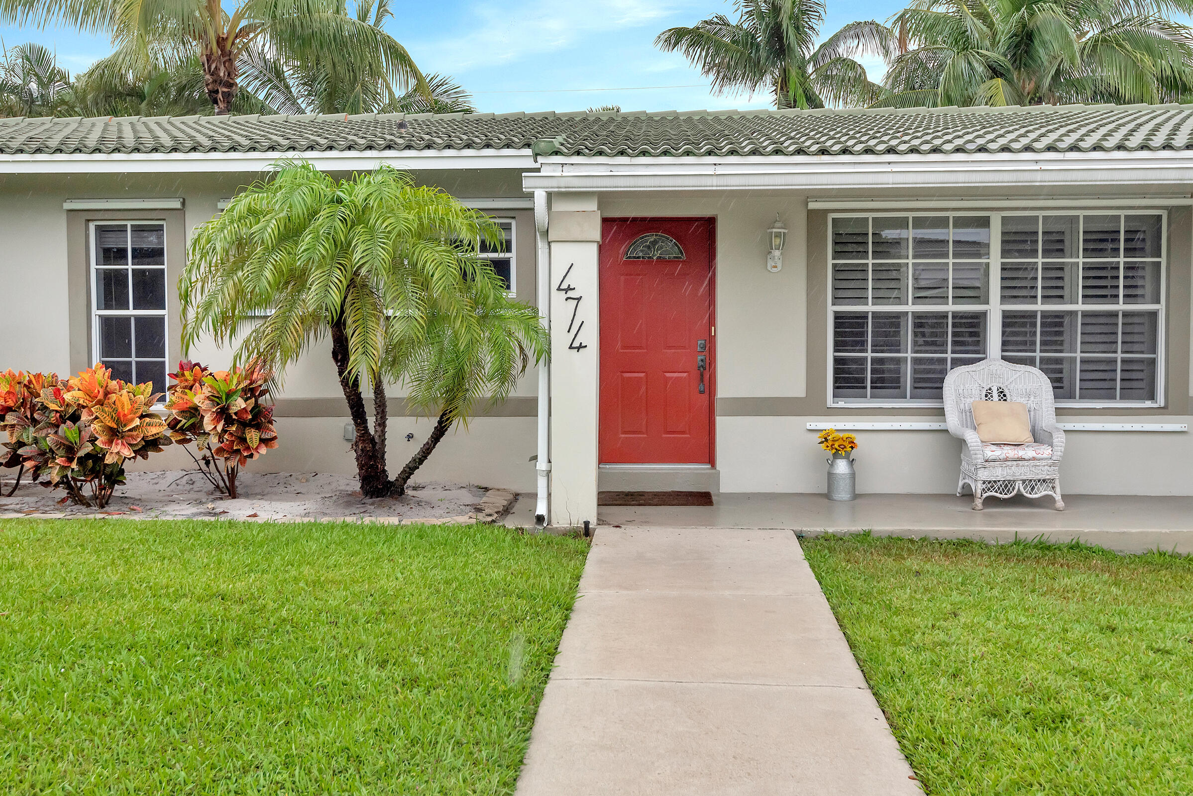 474 Northwest 11th Street Boca Raton, FL 33432 - Photo 10 of 61 a front view of a house with garden