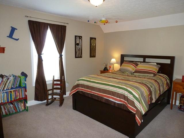 1894 Portway Road Spring Hill, TN 37174 - Photo 8 of 20 Upstairs bedrooms are huge! Plenty of room for a large bed and lots of other furniture. Ceiling fan, Split zone unit with separate thermostat for upstairs keeps it nice and comfortable year round.