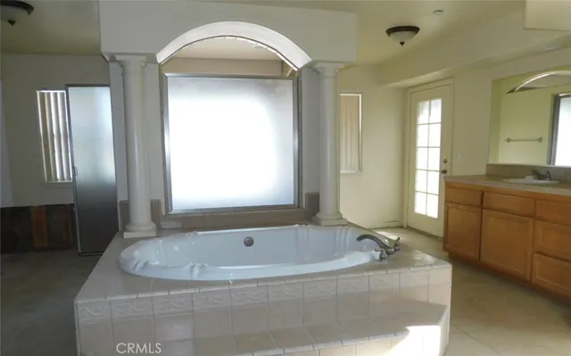 a view of a livingroom with a ceiling fan and window